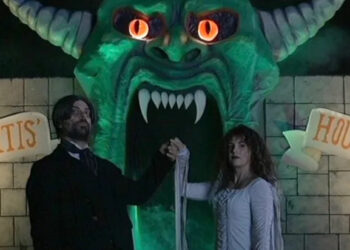 Dr. Mortis and wife in front of Dr. Mortis' House of Horrors home haunt in V/H/S/Halloween.