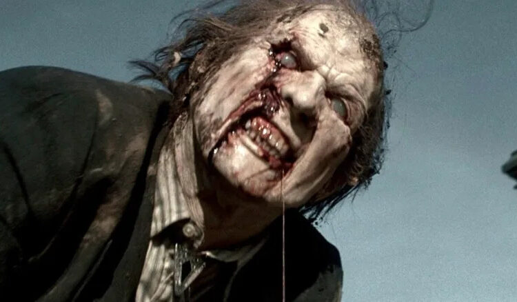 A rotting ghoul drips slime in Night of the Living Dead 1990