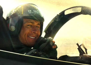 Hangman smiling in his cockpit in Top Gun: Maverick