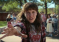 Millie Bobby Brown's Eleven holding her hand out in Stranger Things season 4