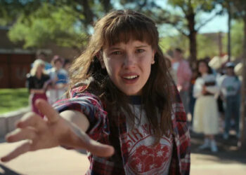 Millie Bobby Brown's Eleven holding her hand out in Stranger Things season 4