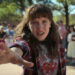 Millie Bobby Brown's Eleven holding her hand out in Stranger Things season 4