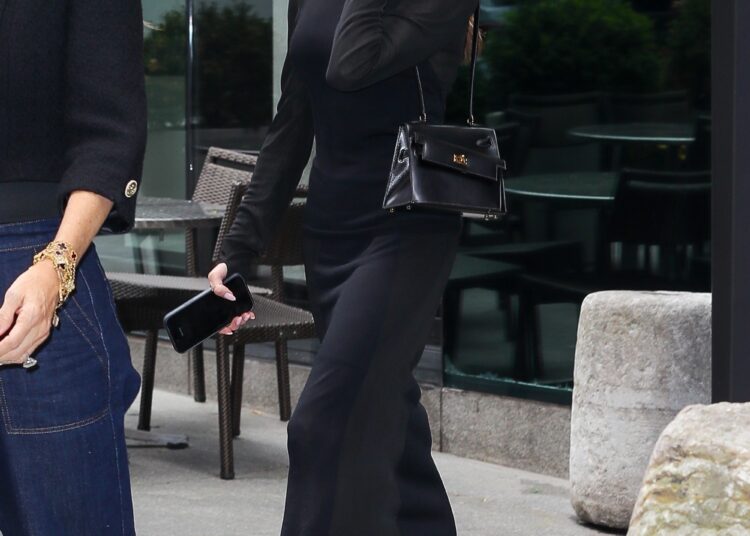 Victoria Beckham ended her colorful streak in an all-black skirt set and a rare Herm&egrave;s Kelly bag