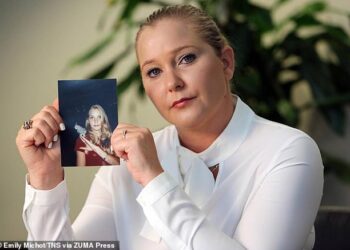 Prince Andrew's sex accuser Virginia Giuffre (pictured with a photo of herself as a teen) lost a baby days after having an orgy with Prince Andrew and eight other girls, her tell-all memoir claims