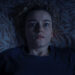 Julia Garner looks terrified in her bed in Weapons.