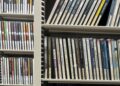 A shelf with many dvd cases.