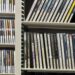 A shelf with many dvd cases.
