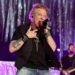 Watch Axl Rose throw mic at and kick new Guns N' Roses drummer's kit before storming off stage in Argentina