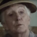 Joan Hickson's Miss Marple wearing a beige hat and looking thoughtful on Miss Marple