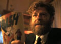 Rabbi Uris holding a Flash comic in It: Welcome to Derry