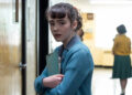 Clara Stack as Lily holding books in school in It: Welcome to Derry episode 1