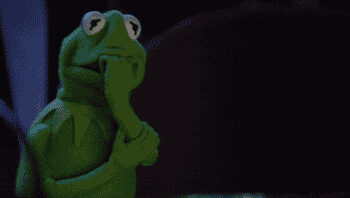 Kermit the Frog, looking nervous, bites his hand in a dramatic moment from a TV show or movie scene