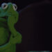 Kermit the Frog, looking nervous, bites his hand in a dramatic moment from a TV show or movie scene