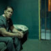 Chris Smith (John Cena) in prison at the end of Peacemaker season two.