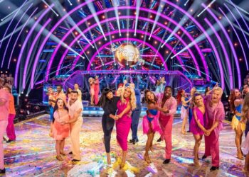 dancers celebrating on stage at a dance competition