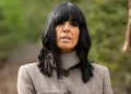 BBC Claudia Winkleman wearing a jacket while standing outside in the Scottish Highlands, filming the Celebrity Traitors