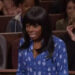 A person wearing a blue patterned shirt appears surprised or distressed in a courtroom setting on a TV show