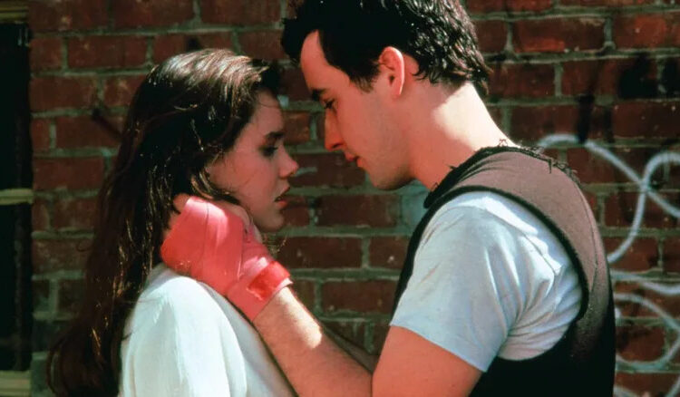 Diane and Lloyd, heads together, him all sweaty, in Say Anything...