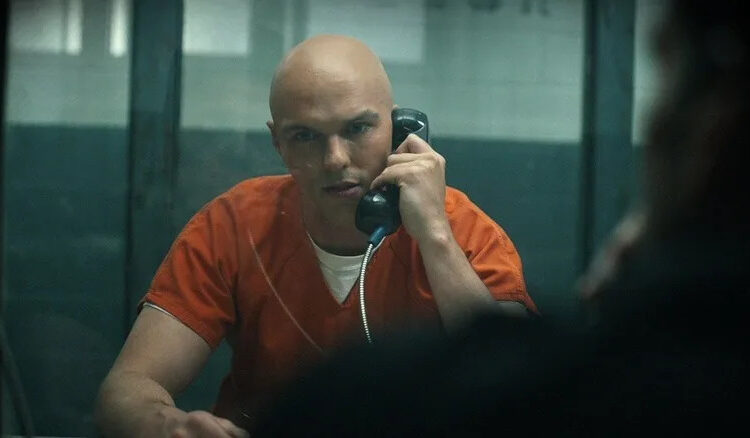 Nicholas Hoult as Lex Luthor talking to Frank Grillo as Rick Flag in jail in Peacemaker season 2