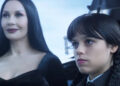 Morticia smiles while Wednesday sulks in Season 1 of Wednesday