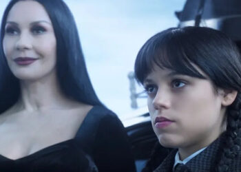 Morticia smiles while Wednesday sulks in Season 1 of Wednesday
