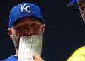 Royals hitting coach Alex Zumwalt goes over strategy with Maikel Garcia during a game against the Minnesota Twins.