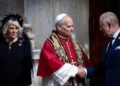 King Charles shakes hands with Pope Leo XIV in the courtyard as Queen Camilla watched on.