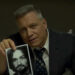 Holt McCallany holding up photograph in Netflix's Mindhunter.