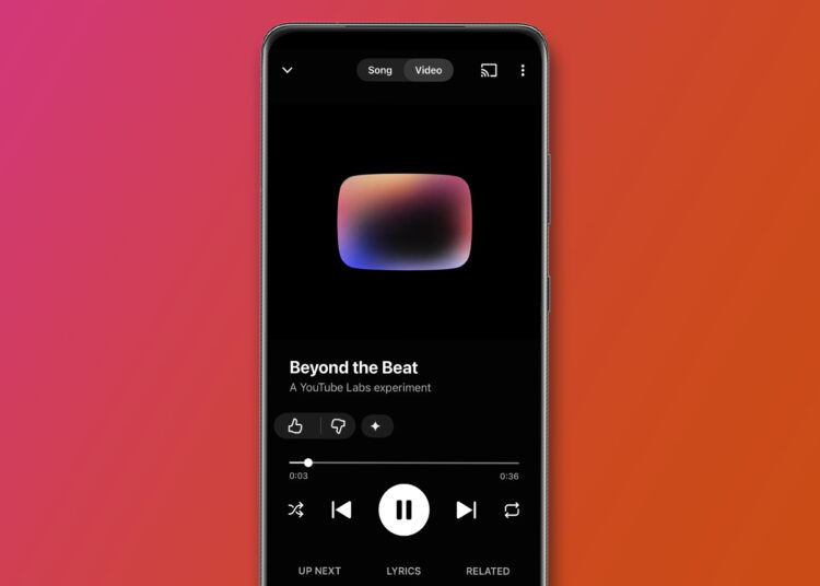 An Android phone on a pink and orange background showing YouTube Music