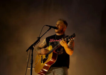 Zach Bryan performs at Nissan Stadium in Nashville, Tenn., Saturday, June 29, 2024. His newly teased song "Bad News," condemns the recent ICE raids around the country.