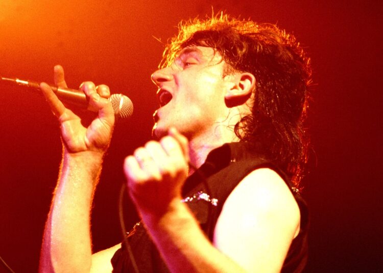 Bono of U2, performing in 1983