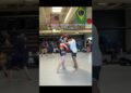 Beginner woman martial artists holding properly holds pads