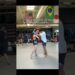 Beginner woman martial artists holding properly holds pads