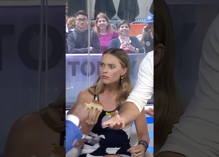 Margot Robbie’s reaction to Matthew McConaughey being in the building is all of us.