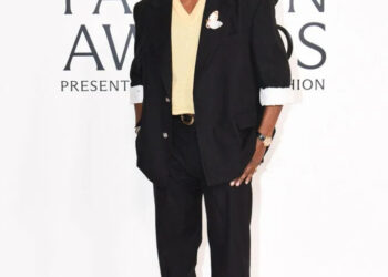 A$AP Rocky, CHANEL menswear, 2025 CFDA Fashion Awards menswear, Style Icon Award, black silk gabardine suit, yellow knit top, ecru silk trunk, CHANEL belt, two-tone shoes