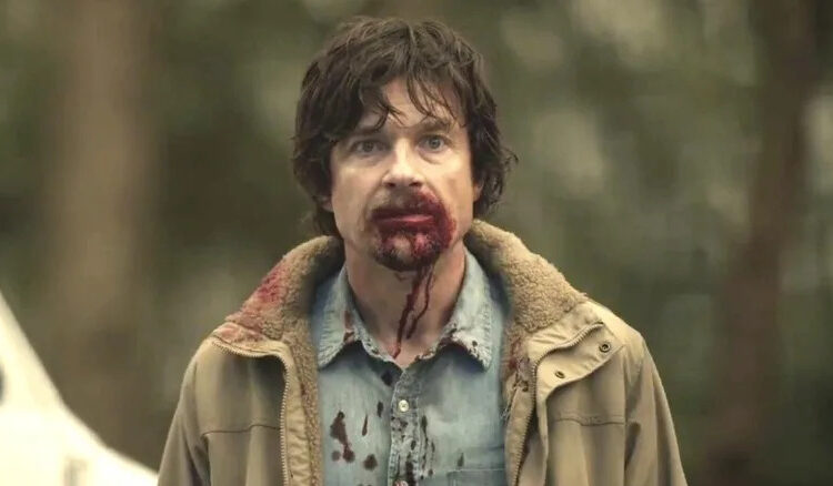 Jason Bateman as Terry Maitland with blood on his face in The Outsider