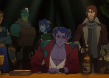The Mighty Nein posing together in a dark room