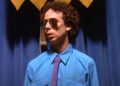 Kevin Sussman as Steve in a suit and sunglasses in "Wet Hot American Summer" (2001)