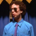 Kevin Sussman as Steve in a suit and sunglasses in "Wet Hot American Summer" (2001)