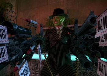 Stanley Ipkiss, possessed by the Mask, holding large cartoony guns in The Mask
