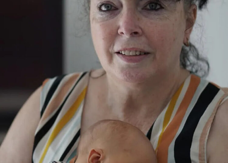 Adam’s mother Caroline with his son George (Instagram)