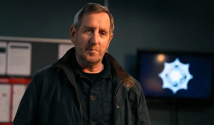 Colly gazes into the camera in Blue Lights
