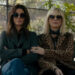 Sandra Bullock as Debbie and Cate Blanchett as Lou sitting on a bench in Ocean's 8