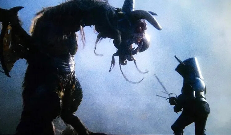 Michael Palin as Dennis Cooper does battle with a winged monster in Jabberwocky