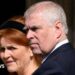 A file photo from the 2025 Easter Service at St George's Chapel in Windsor of the then-Prince Andrew, wearing a dark suit and pictured in a three-quarter view, with Sarah Ferguson, who has a black Alice band in her hair, standing behind him.