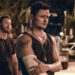 Moe holding his cast with a look of pain in his eyes in Road House