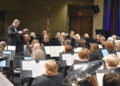 Rich Shelton, the conductor and music director of the Arizona Winds, leads about 75 musicians through a patriotic concert Oct. 12 to open the band&rsquo;s 51 season at the Vista Center for the Arts in Surprise.
