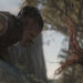 Dimitrius Schuster-Koloamatangi as Dek facing off with a tree tentacle in Predator: Badlands