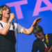 Tim Burgess, wearing a white T-shirt and black dungarees and sporting his long blond basin haircut, sings on stage as The Charlatans perform on The Other stage at Glastonbury six years ago.