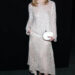 elle fanning wears a sequined top and skirt